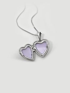 DESCRIPTIONWe heard you, white gold lovers! Get the silver look but without the tarnishing!A white gold sweet heart locket is placed on our 0.5mm Box Chain, with lots of love and nostalgia, too. Locket holds up to 2 images so be sure to include your bestie, lover, dog, or yourself...we won't judge <3 DETAILS - always made in 14k white gold- pendant measurement: 13mm x 12mm- model wears a 16” Silver Heart Charm Locket Necklace, Silver Heart Cut Locket Necklace With Heart Charm, White Gold Locket Necklace For Anniversary, Anniversary White Gold Locket Necklace, Sterling Silver White Gold Heart Charm Locket Necklace, Silver Heart Cut Locket Necklace For Valentine's Day, Heart Shaped Locket Necklace In White Gold, White Gold Locket Necklace For Valentine's Day Gift, White Gold Sterling Silver Locket Necklace With Heart Charm