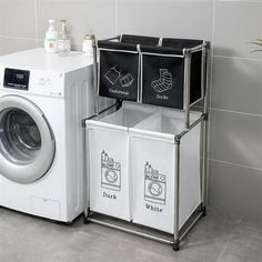 a washer and dryer sitting next to each other in front of a tiled wall