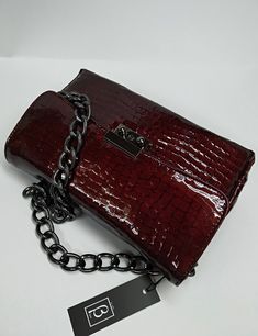 An elegant classic style bag with a strong scent of the legendary original designs that marked deeply the modern fashion, made of high quality genuine greek calf leather, processed properly in order to resemble croc leather. The bag's inner space is seperated in three (3) divisions, as also a zipped pocket is included. The chain is made of black nickel and it's proper for the use of the bag as a Shoulder Bag. The bag includes a safety lock, which can be opened simply via sliding the small round Trendy Textured Leather Formal Bag, Faux Leather Shoulder Baguette Bag For Evening, Evening Baguette Bag With Removable Pouch In Faux Leather, Evening Faux Leather Baguette Bag With Removable Pouch, Classic Leather Evening Bag As Gift, Evening Shoulder Baguette Bag In Faux Leather, Elegant Bags With Removable Pouch In Faux Leather, Classic Leather Evening Bag, Elegant Faux Leather Bag With Removable Pouch