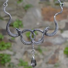 Intertwined Snakes With Poison Drop Necklace in 4 - Mounteen Silver Snake Necklace For Party, Mystical Silver Necklace For Party, Gothic Wire Wrapped Pendant Jewelry, Spiritual Metal Jewelry In Snake Shape, Spiritual Snake-shaped Metal Jewelry, Gothic Chain Jewelry As A Gift, Gothic Wire Wrapped Metal Jewelry, Mystical Metal Necklaces For Parties, Gothic Silver Wire Wrapped Jewelry