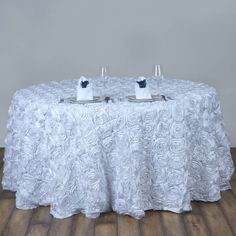 a table with two glasses and plates on it