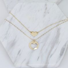 "Mother Daughter Necklace Set. 14K gold necklace Mother's necklace: - 14K gold charm is about 13mm. - 14K gold necklace Daughter's Necklace: - 14K gold heart charm is about 10mm x 8mm - 14K gold necklace Necklace size chart: average 0 - 12 months 10\" average 12 - 24 months 12\" average 2-3 years 13\" average 4-5 years 14\" average 5-10 years 15\"-16\" 14K gold components Your necklaces will be shipped in a gift box. To see other Mother daughter set click here: https://www.etsy.com/shop/SashJewe 14k Gold Filled Yellow Gold Charm Necklace For Anniversary, Everyday 14k Gold Open Heart Charm Necklace, Minimalist 14k Gold Filled Open Heart Jewelry, Gold Plated Double Heart Necklace For Mother's Day, Gold Open Heart Charm Jewelry, Gold Double Heart Charm Necklace, Dainty 14k Gold-filled Yellow Gold Heart Necklace, Gold Open Heart Charms Jewelry, Everyday Double Heart 14k Gold Charm Necklace