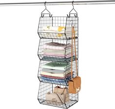 a metal wire hanging organizer with four shelves and two bags on top of each shelf