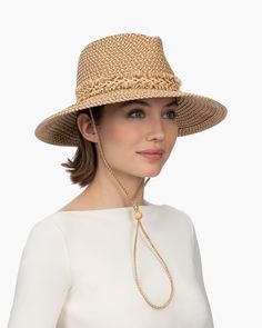 Tucson is a designer woman's sunhat for sale made of Squishee®. The modified Western shape has a fringe-edged band and a self-bolo braid chin strap with a wood bead to adjust and secure it. The signature logo rivet is discretely placed at the back of the crown. The wired brim permits shaping; push up the sides for more Western flare, or flatten them out for additional shade. Squishee® is a man-made material incorporating recycled fibers. It looks and feels just like natural raffia but has the ad A Wood, Signature Logo, Straw Hat, Tucson, Wood Beads, Ultra Violet, Sun Hats, Straw, Braids