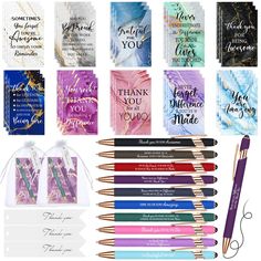 many different pens and cards with writing on them