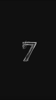 the number seven is made up of metal pipes and glass tubes on a black background