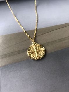 Gold Round Disc Necklace, Byzantine ICXC NIKA Cross Necklace, Christian Orthodox Necklace, Mother's Day Gift, Unisex Religious Necklace Excellent quality ICXC NIKA coin necklace. It's the absolute must-have for the modern woman! Easy to combine with every outfit, it adds luxury to your style! This beautiful necklace features a 24k gold plated (over brass) chain, at a standard length: 45 cm (17.7 inches) and a gold plated brass coin (2 cm) with the ICXC NIKA inscription on it! Get yours now! ✪PLE Handmade Byzantine Round Necklace, Handmade Byzantine Style Necklace, Byzantine Round Pendant Necklace For Gift, Byzantine Style Round Pendant Necklace For Gift, Gold Byzantine Round Necklace, Orthodox Necklace, Xmas Gifts For Mum, Danty Necklace, Cross Necklace Simple