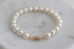 This classic timeless bracelet is the perfect accessory for any occasion.  Whether you are walking down the aisle or attending a special event this is a must have! Pearls never go out of style. It is hand beaded with Austrian crystallized pearls and finish off with a filigree fish hook clasp.  Clasp is sterling 14Kt gold filled. Available in silver in sterling silver. You can make this bracelet a dainty style by choosing 3-4mm pearls or bold with 8mm pearls.  Choose yours at checkout. Bracelet measures about 7 1/2" long but length can be customized.  Please leave your wrist measure at checkout.  A 7 1/2" bracelet will comfortably fit up to a 6 3/4" wrist leaving some room for movement. If you need a longer length please let me know. Pearls are available in different colors and sizes. Classic Gold Pearl Drop Bracelet, Formal White Pearl Bracelets, Formal White Pearl Embellished Bracelets, Classic Pearl Drop Bracelet For Wedding, Elegant Wedding Bracelets With Pearl Drop, Elegant Wedding Bracelets With Pearl Chain, Elegant Pearl Chain Bracelets For Wedding, Elegant Pearl Chain Bracelet For Wedding, Classic White Pearl Bracelet For Wedding