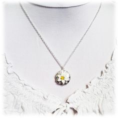 "Handcrafted Easter Lily Locket Necklace featuring hand sculpted white flower and a filigree backdrop on a shiny silver tone locket. -Locket : 2cm (approx. 3/4 inch) silver-plated locket -Interior Locket (for photo) : 13mm (1/2 inch) -Cable Chain : Choose silver plated or upgrade to 925 sterling silver -Length : Choose 16\" or 18\" cable chain View matching collection at: https://www.etsy.com/shop/strandedtreasures/search?search_query=easter+lily Flowers are hand sculpted without molds or paint Sterling Silver Birth Flower Medallion Jewelry, Sterling Silver Medallion Necklace With Flower Charm, Silver Flower Pendant Locket Jewelry, White Flower Pendant Necklace With Birth Flower, Silver Jewelry With Flower Pendant Locket, White Sterling Silver Jewelry With Flower Charm, White Flower Pendant Necklace Gift For Her, White Flower Charm Necklace, Silver Locket Necklace With Flower Charm As Gift