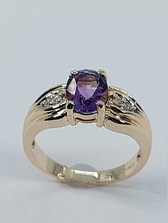 This stunning timeless style ring has been carefully crafted in warm 10k yellow gold, authentic Amethyst and authentic White Diamonds Great for any occasion! Buy it for your-self or for someone you love! This beautiful ring will not go unnoticed. All of my jewelry is handmade from scratch and of high quality. A tracking shipping number will be provided to you once the ring has been mailed. Ring Measurements: Ring is size 6 1/4  but can be resized at no extra cost and will be shipped to you in an Purple Gemstone Diamond Ring In 14k Gold, Purple Diamond Ring In 14k Gold, 14k Gold Purple Ring With Diamond Accents, Yellow Gold Amethyst Ring With Accent Stones, Round Cut, Yellow Gold Amethyst Ring With Round Cut Accent Stones, Purple 14k Gold Fine Jewelry Rings, Fine Jewelry 14k Gold Purple Diamond Ring, 14k Gold Purple Sapphire Ring With Accent Stones, 14k Gold Ring With Purple Center Stone