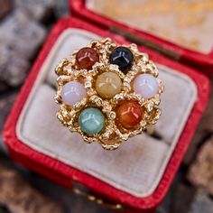 This beautiful vintage ring is accented with jade spheres, in multiple colors, set into floral motif textured gold. The ring is crafted in 14k yellow golden is currently a size 6. Elegant Yellow Gold Jade Rings, Heirloom Yellow Gold Jade Rings, Luxury Yellow Gold Jade Rings, Gold Jade Cabochon Rings, Collectible Yellow Gold Jade Jewelry, Lavender Ring, Beautiful Rings Vintage, Jade Ring, February Birth Stone