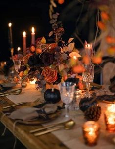 the table is set with candles and flowers