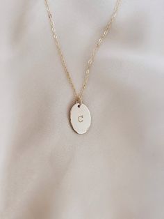 Custom Personalized Oval Initial Necklace. Makes a great gift with your fave initials! Is hand stamp with personalizing your choice letter name. Details: ~ Material: 14K gold filled, 14K rose gold filled or sterling silver ~ Mesure Oval : 11x16mm ** write your favorite letter in “NOTE FOR THE SELLER” this appears in a rectangle box in your cart ** Personalized Oval Gold Necklaces, Personalized Gold Oval Necklace, Personalized Oval Gold Necklace, Oval 14k Gold-filled Jewelry For Anniversary, Minimalist Engraved Jewelry With Oval Link, Personalized Oval 14k Gold Jewelry, Minimalist Engraved Oval Link Jewelry, Classic Oval Link Personalized Necklace, Classic Personalized Oval Pendant Necklace