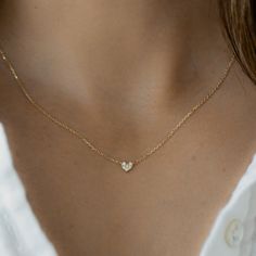 "Super dainty heart necklace that is delicate and great for stacking. It's minimalist design allows for tons of versatility with this piece! It is also great for kids jewelry, as a gift for a loved one, or a token/reminder of self love! Love how small and dainty it is! - - - D E T A I L S - - - * Made of 925 Sterling Silver * THICK plating of 14k Gold or Rhodium  * 16\" + 3\" Extension Chain  * Heart Pendant: 5mm * Nickel-free & Hypoallergenic * Made of the highest quality cubic zirconia stones for an authentic diamond look! Comes in a gift box, ready for gift-giving! 🎁 Made with 100% Pure Love! ♡ Let's Connect! 🥰 IG: samijewels_" Luxury Dainty Double Heart Necklace, Luxury Dainty Heart Cut Necklace, Luxury Minimalist Heart-shaped Necklace, Luxury Dainty Diamond Heart Necklace, Luxury Minimalist Yellow Gold Heart Necklace, Dainty Heart Necklace, Engraved Heart Necklace, Tiny Heart Necklace, Chain Heart