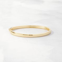 This stunning solid bangle bracelet is super trendy and stylish! It's comfortable and lightweight. Looks great stacked or on its own! We use a THICK plating of 14k Gold or Rhodium over 925 Sterling Silver Super high-quality & lightweight Available in 5.5", 6", 6.25", 6.75", 7", 7.5", or 8" Latch Closure 4mm thick N Chunky Earrings, Chunky Rings, Celestial Jewelry, Stacked Jewelry, Initial Jewelry, Statement Bracelet, Timeless Jewelry, Sapphire Jewelry, Anklet Jewelry