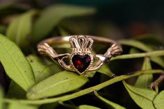 The Garnet Claddagh ring. Traditional Irish ring. Sign of love, loyalty, and friendship. The ring, as currently known, was first produced in the 17th century. Piece of our Celtic Jewelry collection. Best match of Garnet Promise Ring. : Main gemstone: Garnet Metal: Gold 585o (14K) Average weight: 2,7 gr. : * If desired, we can replace the main gem with any of the following: Amethyst, Alexandrite, Citrine, Emerald, Garnet, London Blue Topaz, Sky Topaz, Peridot, Smoky Quartz, Sapphire, Ruby. * If t Irish Wedding Rings, Irish Ring, Sign Of Love, Gold Claddagh Ring, Irish Ring Claddagh, Irish Rings, Irish Claddagh, Claddagh Ring, Claddagh Rings