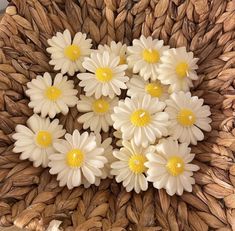 some white and yellow flowers in a basket