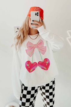 This Cute Valentines Sweatshirt is the perfect gift or outfit for valentines day. Its trendy, fun and cute for valentines. Soft girl era!!  This valentines day be trendy and cozy in our cherry heart with a ribbon sweatshirt. Disco Hearts Q U I C K * F A C T S * ♥️ 100% Soft cotton ♥️Design is high quality digital print ♥️ Wash and dry normally. Do not iron directly on the print. * S I Z I N G * ♥️ Sizing is unisex so runs like men's ♥️Most women find their typical size works best. ♥️ Please see Sweet Long Sleeve Graphic Print Top, Sweet Long Sleeve Tops With Graphic Print, Playful White Long Sleeve Sweatshirt, Sweet Long Sleeve Cotton Sweatshirt, Cute Sweatshirt With Funny Print And Crew Neck, Cute Crew Neck Sweatshirt With Funny Print, Trendy Long Sleeve Sweatshirt With Funny Print, Playful White Sweatshirt For Loungewear, Cute Long Sleeve Graphic Sweatshirt