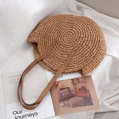 Unleash Vintage Vibes with Our Handcrafted Round Straw Beach Bag Step into the allure of bohemian elegance with our exquisite Round Straw Beach Bag. Handwoven to perfection, this timeless piece by Yogodlns encapsulates the essence of vintage charm and artisan craftsmanship. Unique Features Handcrafted from premium quality straw for durability and eco-friendliness Soft polyester lining ensures the safety of your essentials Spacious interior with a cell phone pocket for easy organization Zipper cl Macrame Tas, Colors Of Summer, Ribbon Decoration, Ribbon Decorations, Straw Beach Bag, Cozy Accessories, Small Animal Supplies, Rattan Bag, Macrame Bag