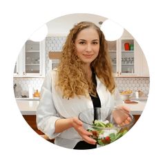 a woman holding a salad in a bowl