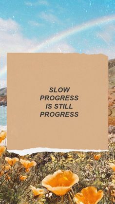 a piece of paper with the words slow progress is still progress written on it in front of some flowers