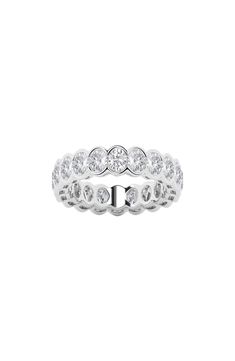 Twinkling white lab-created diamonds dust around a statement-making ring that shines in 14-karat gold or platinum. Total lab-created-diamond weight: 3ct. Color: F–G Clarity: VS2 14k gold, 14k-white gold, 14k-rose gold or platinum/lab-created diamond Imported Diamond Guide Silver Oval Eternity Band With Brilliant Cut, Classic Cubic Zirconia Eternity Band With Bezel Setting, Silver Oval Eternity Band With Prong Setting, Fine Jewelry Oval White Eternity Band, Oval Eternity Band With Prong Setting For Formal Occasions, Silver Oval Eternity Band With Diamond Accents, Oval Diamond White Eternity Band For Formal Occasions, Oval Silver Eternity Band For Formal Occasions, White Oval Eternity Band Fine Jewelry