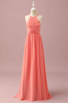 a bridesmaid's dress on a mannequin dummyt in front of a pink background