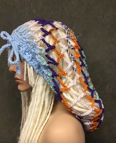 "Crochet Headband/Snood/READY TO SHIP Size: One size fits most Measurements: Fits up to 24\" in circumference/ 16\" in length Colors: variegated Blue/purple,orange,white,yellow Material: acrylic yarn Care:  Hand wash/ lay flat to dry The stylish, easy to wear Snood is making a grand comeback!  Great for dreadlocks or just to keep long hair covered, this lovely snood is crochet in a beautiful soft acrylic yarn in shades of blue, orange, white and purple all intertwined in the most colorful way. Festival Crochet Hat, White Crochet Hat One Size For Festival, Bohemian Crochet Hat For Festival, White Hand Knitted Crochet Hat In Bohemian Style, Hand Knitted Crochet Hat One Size For Festival, Bohemian Crochet Beanie Hat, Hand Knitted Crochet Hat For Festival, Bohemian Crochet Hat One Size, Bohemian Hand Knitted Crochet Hat