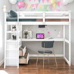 a white loft bed with desk and chair underneath it in a room filled with balloons