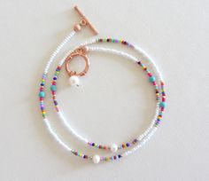 Colorful Beaded Necklace with pearls dainty seed bead choker with turquoise white bead choker necklace summer jewelry rainbow bead necklaces Measure the length of your neck with a measuring tape or you can use any thread, rope, or cable for telephone and after apply the measurements to a regular ruler. Summer Spacer Bead Choker Jewelry, Dainty White Beaded Necklace For Festivals, White Choker Jewelry With Colorful Beads, White Minimalist Beaded Bracelets For Summer, Minimalist White Beaded Bracelets For Summer, Dainty White Beaded Necklaces For Summer, Dainty White Beaded Necklace For Summer, Dainty White Jewelry For Festival, Summer Choker With Spacer And Round Beads