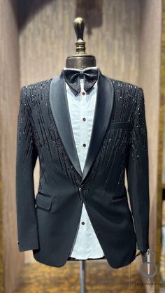 Step into any formal event with unmatched style and sophistication with our Black Embroidered Tuxedo Coat Pant. Meticulously handcrafted with intricate embroidery, this tuxedo exudes elegance and a sense of grandeur. Whether you're attending a wedding, gala, or any special occasion, you'll feel confident and dapper in this stunning ensemble. Made from premium quality fabric, this Black Embroidered Tuxedo Coat Pant is designed for both comfort and durability. The coat features elegant details with exquisite embroidery that adds a touch of luxury, while the pants offer a perfect fit with a modern silhouette. Available in a range of sizes, this tuxedo ensures a flattering fit for different body types. Caring for your Black Embroidered Tuxedo Coat Pant is simple. We recommend dry cleaning to m Tuxedo With Work For Men, Groom Coat Pant Design, Wedding Coat For Men Groom Attire, Sparkly Tuxedo Men, Custom Tuxedos Weddings, Black Coat Pant Men Formal, Mens Suits For Wedding Groom Attire, Embroidery Coat Pant For Men, Sequin Suits Men