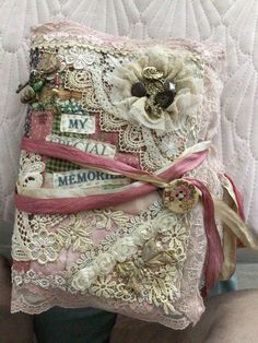 a pillow made out of fabric and lace