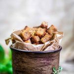 a small pot filled with food sitting on top of a table