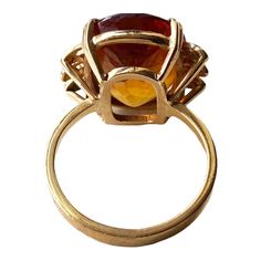 This classic 18K gold ring masterfully displays a magnificent Imperial Citrine quartz crafted in the shape of a large 06.2" x 0.5" x 0.3", weighing 6.5 grams. Size 6, ring size 1" h by 0.75" w by 0.50 " d The stone is set in a center prong style for eye-catching brilliance. This exquisite piece of jewelry is an ideal addition to any fine jewelry collection and provides excellent style and luxury. Citrine is more than just a beautiful gemstone; it carries a wealth of symbolism and cultural signif Gold Crystal Ring With Polished Finish For Formal Occasions, Formal Cabochon Ruby Ring, Luxury Amber Rings For Formal Occasions, Classic Amber Rings For Formal Occasions, Yellow Gold Oval Citrine Crystal Ring, Oval Citrine Crystal Ring In Yellow Gold, Formal Gold Dome Ring With Gemstone, Gold Dome Ring With Gemstone For Formal Events, Gold Dome Ring With Gemstone For Formal Occasions