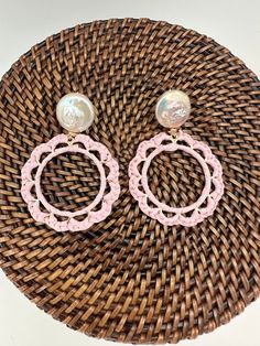 These light, raffia-wrapped earrings are the perfect accessory to add a pop of color and go well with layered necklaces. Measuring 1.5", they are light and easy to wear. Chic Pink Round Earrings, Spring Beach Dangle Earrings, Beach Jewelry Spring Drop Earrings, Dangle Earrings For Spring Vacation, Chic Handmade Earrings For Spring, Spring Vacation Dangle Earrings, Bohemian Spring Earrings For Vacation, Spring Beach Dangle Jewelry, Bohemian Beige Earrings For Spring