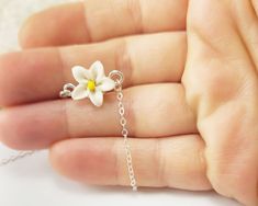 "Tiny adorable white Jasmine Anklet or Bracelet. The white flower flower is handcrafted to a 12mm size and is along a delicate cable chain in a choice of 925 sterling silver or 14k gold filled.Choose from S-M-L-XL length. -Flower Size : 12mm -Chain : Choose 925 sterling silver or 14k gold filled cable chain View matching collection at: https://www.etsy.com/shop/strandedtreasures/search?search_query=jasmine MEASURING GUIDE (using a flexible measuring tape) For a standard fit, measure where you pr Adjustable White Jewelry With Flower Decoration, White Flower Shaped Jewelry With Flower Decoration, White Flower Pendant Jewelry With Flower Decoration, Handmade White Flower Jewelry, White Flower Necklace For Gifts, Small White Dainty Jewelry, White Flower Pendant Jewelry With Floral Decoration, Delicate White Jewelry With Flower Charm, Handmade White Floral Jewelry