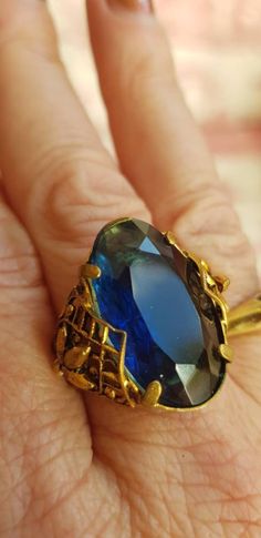 Beautiful vintage ring with intricate detailing to either side. The stone is a deep blue and the gold metal shows signs of once having some blackness. Beautiful Rings Vintage, Blue Antique, Metal Ring, Vintage Ring, Metal Rings, Solitaire Ring, Deep Blue, Antique Gold, Class Ring