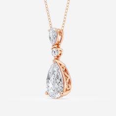 A celebration of smooth curves and sharp edges, this hinged pear shape diamond pendant radiates with effortless elegance. A solitaire lab grown pear shaped diamond creates a beautiful reflection against a smaller pear shaped and round diamond, promoting the elongating effect of this refined shape. Style this pendant on its own for a subtle sparkle or make it the most beautiful part of your layered look.