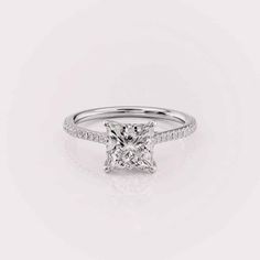 a princess cut diamond engagement ring with pave set shoulders