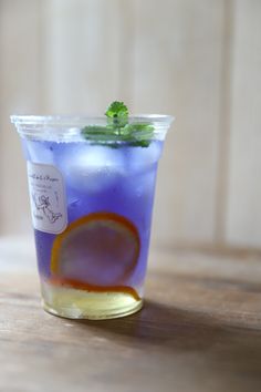 a blue drink sitting on top of a wooden table