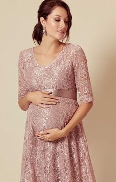 From the pretty sweetheart neckline to the beautiful premium corded lace, our dusky pink maternity dress is a vintage delight, with a full swishy knee-length skirt in a romantic floral lace design lined with premium soft jersey. Maternity Evening Gowns, Rose Tiffany, Maternity Wedding Dresses, Elegant Maternity Dresses, Maternity Patterns, Spring Maternity Outfits, Pink Maternity Dress, Cute Maternity Dresses, Maternity Wedding