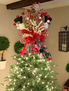 a christmas tree decorated with red, white and green decorations