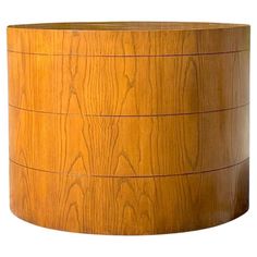 a round wooden box is shown on a white background