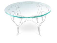 a glass table with metal legs and an oval glass plate on the top that has swirl designs