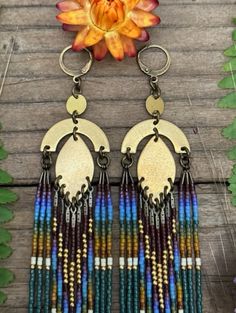 Handmade from raw brass with a natural patina and glass seed beads 7 inches long Each earring weighs 10 grams Brass lever back ear hooks Beaded Earring, Spring Boots, Field Of Dreams, Glass Seed Beads, Raw Brass, Vintage Children, Earring Necklace, Beaded Earrings, Ring Earrings