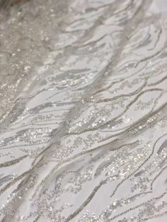 silver sequins and beads on white fabric