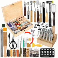 an assortment of kitchen utensils and tools in a wooden box on a white background