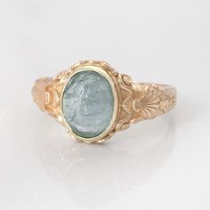 This vintage style sea-themed signet ring, featuring beautiful little shells and ocean-inspired fluorishes all around the center which displays a lovely seafoam green tourmaline cabochon. You may also select from other available gemstones shown such as citrine, pink tourmaline, peridot and aquamarine.  (NOTE: Please SELECT and state in the order notes the stone you prefer in the listing! Please also note that gemstones can vary slightly in color and texture. Upon request, we can send a photo of Lily Ring, Ocean Ring, Green Stone Ring, Ring Inspo, Unique Rings Vintage, Green Stone Rings, Photo Packages, Monogram Ring, Signet Rings