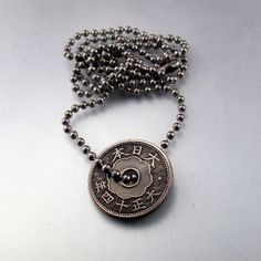 antique JAPANESE COIN JEWELRY necklace. pendant. sen. flower oriental. chrysanthemum. mens necklace . chain No.001124 by PartsForYou on Etsy https://www.etsy.com/listing/124369742/antique-japanese-coin-jewelry-necklace Antique Medallion Jewelry For Good Luck, Vintage Coin Pendant Jewelry For Good Luck, Antique Engraved Jewelry For Good Luck, Vintage Good Luck Coin Pendant Jewelry, Antique Engraved Necklace For Good Luck, Antique Engraved Good Luck Necklace, Vintage Engraved Jewelry For Good Luck, Vintage Brass Jewelry For Good Luck, Vintage Pendant Necklaces For Good Luck