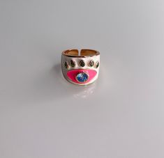 Gorgeous enamel Ring! This ring is more than a fashion statement, it is also a beautiful piece of artwork! Grab yours today! Specifications: . Enamel - Turquoise and Blue Evil Eye Ring . Adjustable Gold Enamel Hand Painted Rings, Hand Painted Gold Enamel Rings, Hand Painted Enamel Gold Rings, Trendy Pink Enamel Ring For Gift, Trendy Pink Enamel Ring As Gift, Adjustable Pink Enamel Rings, Handmade Gold Enamel Ring, Adjustable Enamel Round Ring, Adjustable Round Enamel Ring